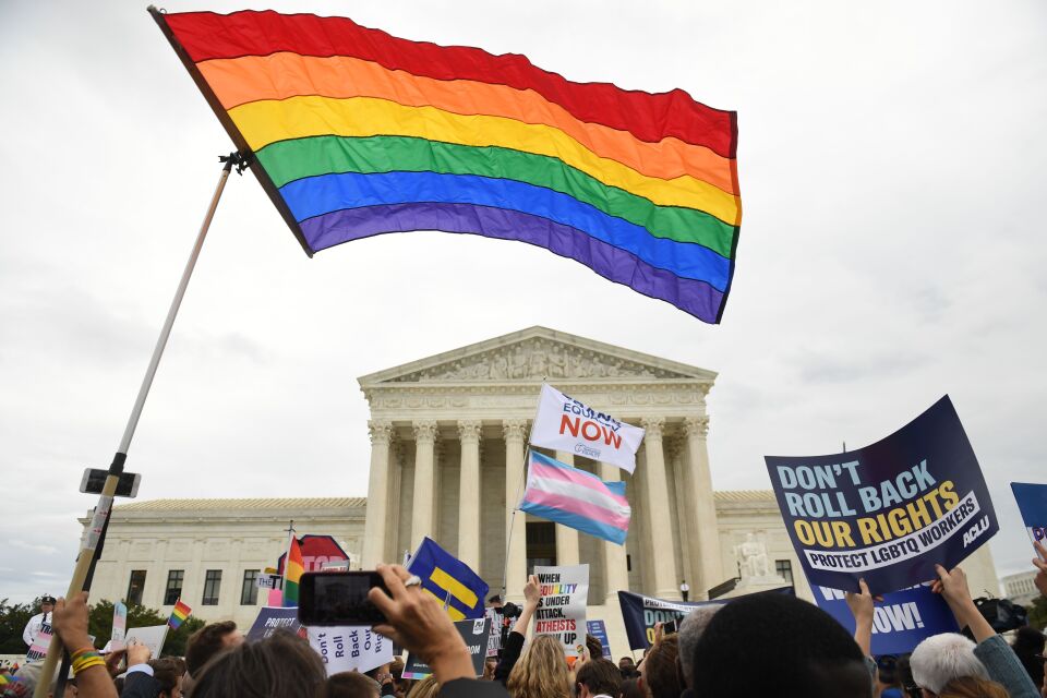 Demonstrators in favour of LGBT rights rally outside the US Supreme Court in Washington, DC, October 8, 2019, as the Court holds oral arguments in three cases dealing with workplace discrimination based on sexual orientation. (Photo by SAUL LOEB / AFP) (Photo by SAUL LOEB/AFP via Getty Images)