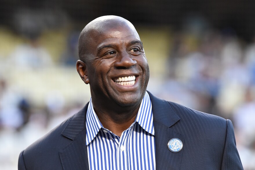 LOS ANGELES, CA - APRIL 15:  Magic Johnson attends a ceremony honoring Jackie Robinson before the game between the San Francisco Giants and the Los Angeles Dodgers at Dodger Stadium on April 15, 2016 in Los Angeles, California.  All players are wearing #42 in honor of Jackie Robinson Day. (Photo by Lisa Blumenfeld/Getty Images)