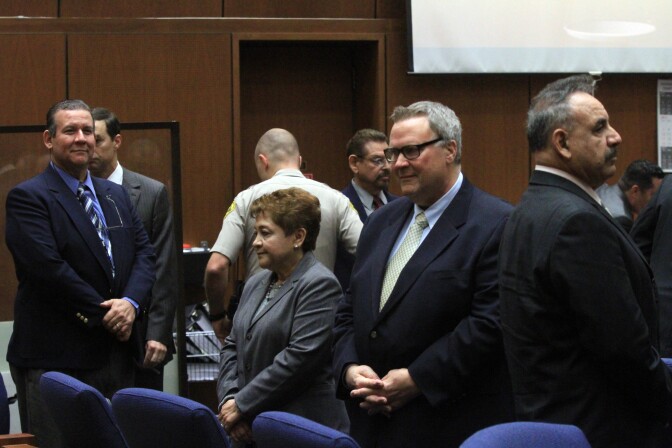 LOS ANGELES, CA - FEBRUARY 20:  Former Bell council members Luis Artiga, left, Teresa Jacobo, George Mirabal, George Cole and former Mayor Oscar Hernandez stand in respect of jury as closing arguments session breaks for lunch on February 20, 2013 in Los Angeles, California. Six former city officials are charged with misappropriating public funds and, if convicted, can spend 12 to 21 years in prison. (Photo by Irfan Khan-Pool/Getty Images)
