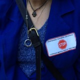 Disability Rights California attorney Ann Menasche wears an anti-Laura's Law sticker at the Orange County Board of Supervisors meeting.