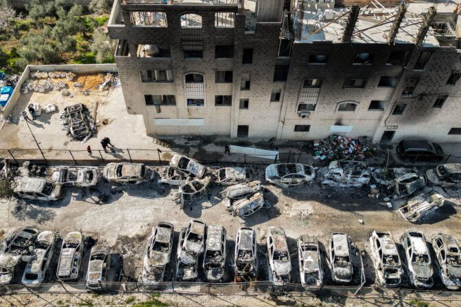 An aerial view of a scrapyard where cars were torched overnight, in the Palestinian town of Huwara near Nablus in the occupied West Bank.