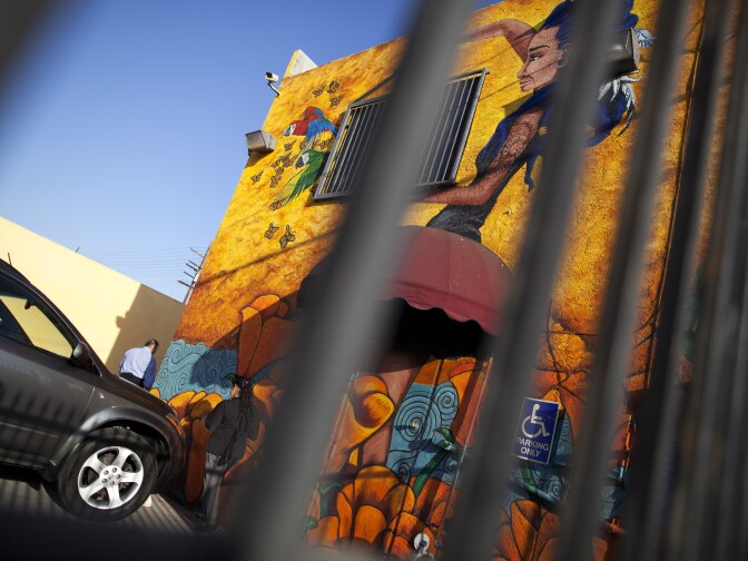 This work titled "Decolonization" is painted on the side of an insurance business along Bradley Avenue in Pacoima.