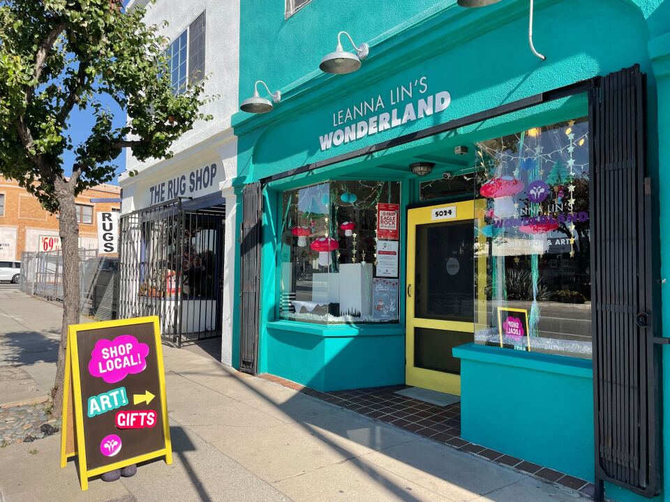 This is a picture of a rug shop and a bright teal colored gift shop in Los Angeles. 