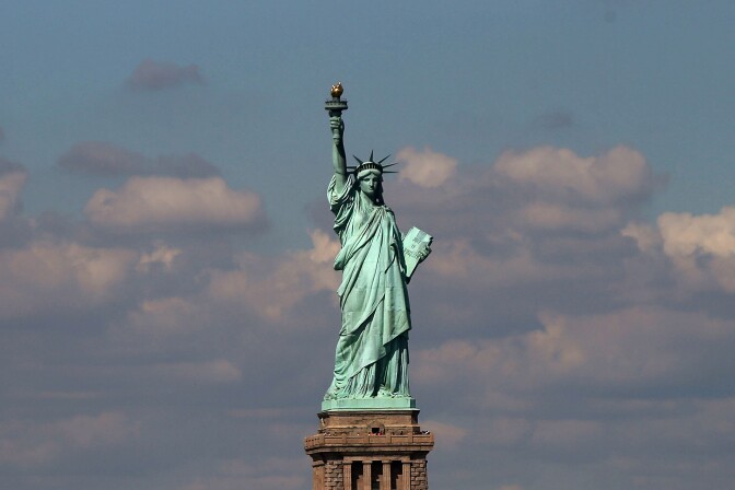 The Statue of Liberty, one of New York's premiere tourist attractions, is viewed from the Staten Island Ferry on September 30, 2013 in New York City. 