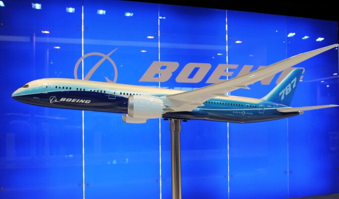 A model display of a Boeing 787 Dreamliner is exibited at the Singapore Airshow in Singapore on February 14, 2012. Boeing and Indonesian carrier Lion Air formally signed a 22.4 billion USD deal for 230 aircraft, the single largest contract in commercial aviation history.   
