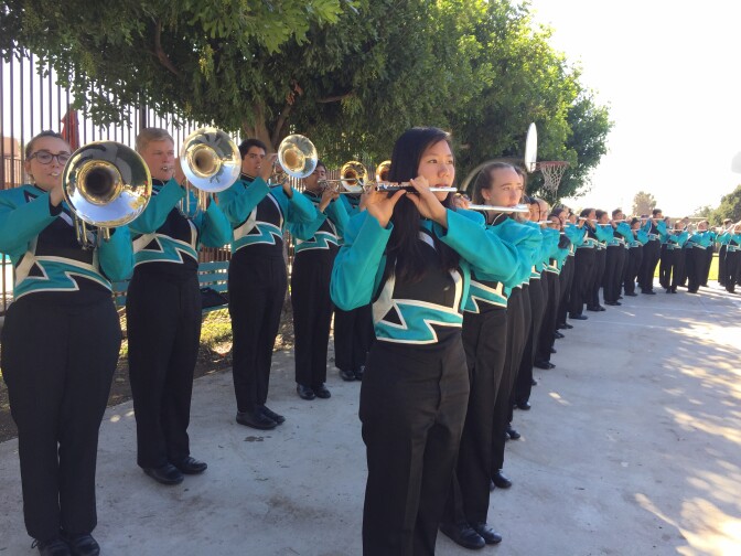 The Bands of Santiago Sharks from Santiago High School in Corona play songs about California and America at Five Acres, a children & family services agency in Altadena.