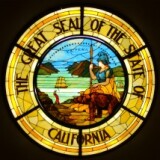 The California State Seal rendered in a stained glass window.