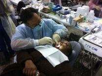 Rose Johnson Brown of Los Angeles receives dental work at the free medical clinic at Los Angeles Sports Arena in Exposition Park.