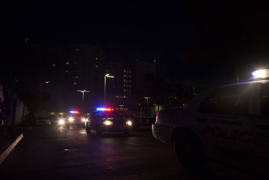 Police cars leave Loma Linda Hospital on February 12, 2013.