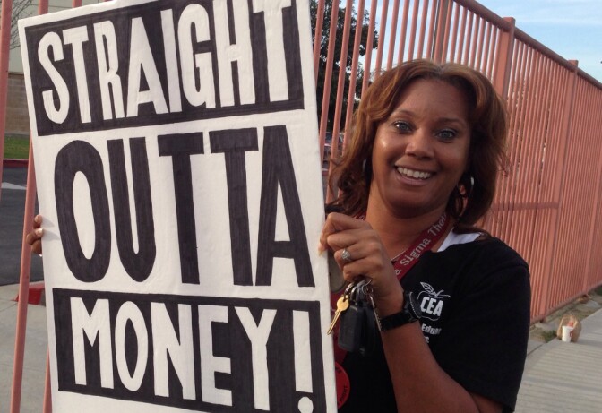 Compton second grade teacher Tamara Carter protests for a pay increase at school district headquarters.
