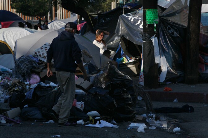 Tijuana, BAJA CALIFORNIA, Mexico - December 16, 2018.  At the Benito Juarez Sports Complex near downtown Tijuana,  Maria Isabel Reyes, 40, center, stands amid the garbage and migrant tents.


In Tijuana, Mexico, children members of the migrant caravan are learning to live in limbo as they move between shelters, settling in as much as possible to create a sense of normalcy, with help from NGOs, counselors and aid organizations. (Photo by Peggy Peattie)