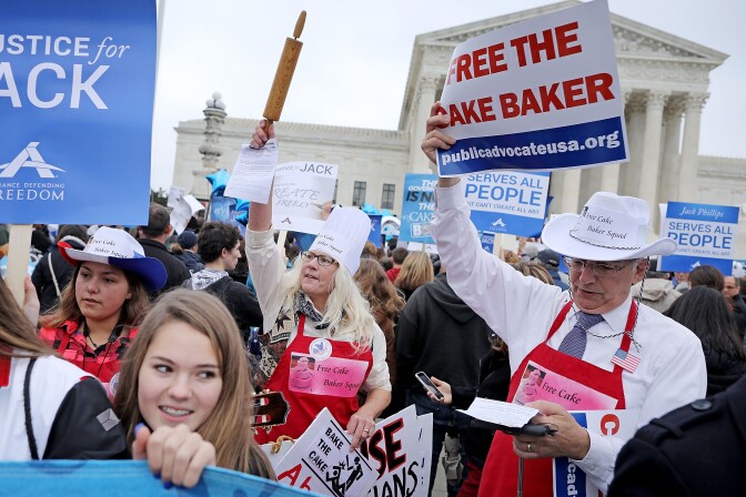 WASHINGTON, DC - DECEMBER 05:  Demonstrators rally in front of the Supreme Court building on the day the court is to hear the case Masterpiece Cakeshop v. Colorado Civil Rights Commission December 5, 2017 in Washington, DC.  Charlie Craig and Dave Mullins filed a complaint with the commission after conservative Christian baker Jack Phillips refused to sell them a wedding cake for their same-sex ceremony.  (Photo by Chip Somodevilla/Getty Images)