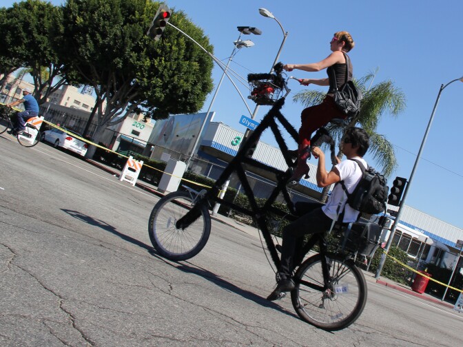 A double decker bike turns onto 9th Street at L.A.'s third CicLAvia event on October 9, 2011.