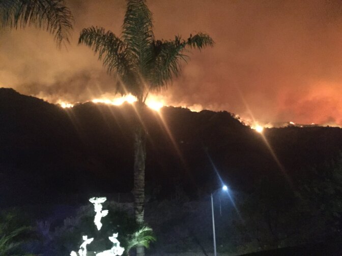 The La Tuna Fire burns in the hills above Burbank, early September 2, 2017.