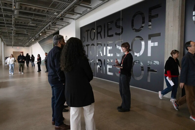 People taking a tour in the Academy Museum with a tour guide