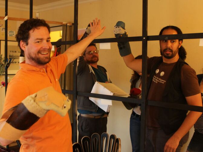 Charley Knapp directs the Sock Puppet Theater cast for its performance of "Hogan's Heroes."