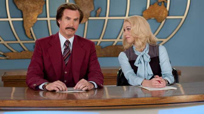 Will Ferrell and Christina Applegate sit at a large desk infront of a backdrop of a outlined globe. Their characters are news anchors from the 70s. Ferrell wears a red, burgundy suit while Applegate wears a light blue pussy-bow blouse with a  grey sweater vest.