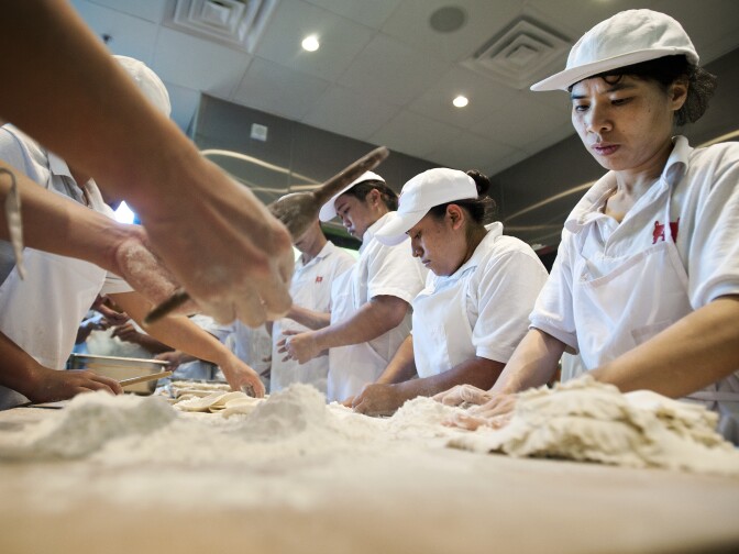Cooks make pork and shrimp shumai dumplings at Din Tai Fung Dumpling House in Arcadia on Aug. 16. Soon, the restaurant will expand to Glendale and Costa Mesa.
