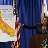 SAN FRANCISCO, CA - OCTOBER 10:  California Attorney General Kamala Harris points to a map as she speaks during a news conference on October 10, 2013 in San Francisco, California. Harris announced the filing of a lawsuit against the for-profit Corinthian Colleges and its subsidiaries for alleged false advertising, securities fraud, intentional misrepresentations to students and the unlawful use of military insignias in advertisements. Santa Ana, California-based Corinthian Colleges operates 111 total campuses in North America with 24 Heald, Everest and WyoTech colleges in California that have an estimated 27,000 students.  (Photo by Justin Sullivan/Getty Images)