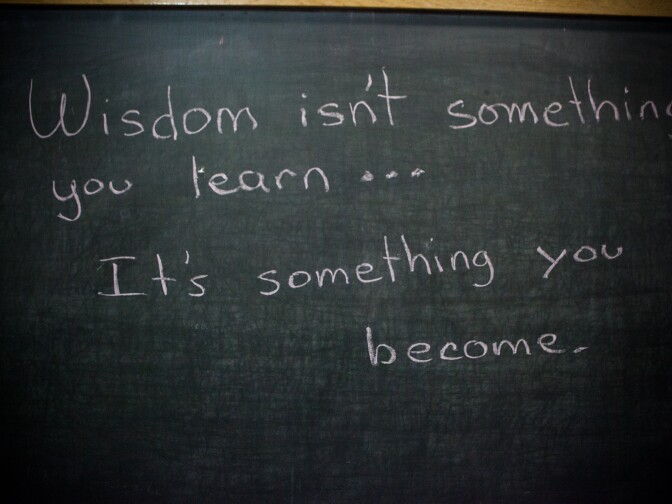 Caryn Quincey writes a quote on the blackboard during a class at the Twin Towers jail on October 2nd, 2013.