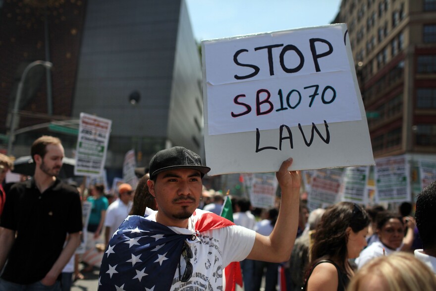 NEW YORK - MAY 01:  Hundreds of activists, supporters of illegal immigrants and members of the Latino community rally against a new Arizona law in Union Square on May Day on May 1, 2010 in New York City. Following the state of Arizona's passage of a new immigration law which requires individuals suspected of being illegal immigrants to show proof of legal residence when asked by law enforcement, immigration supporters have been protesting across the country. The law has become increasingly divisive, with Mexico's president issuing a travel warning to Mexican citizens in Arizona. Thousands of people are taking part in similar protests around the country on May Day, a traditional day of protest around the world.  (Photo by Spencer Platt/Getty Images)