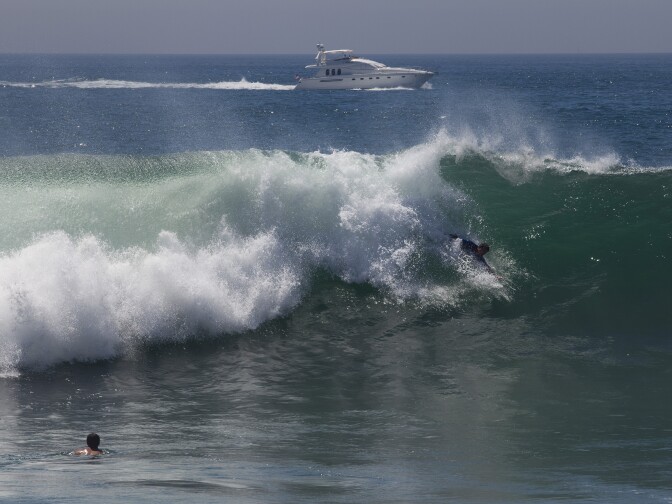 A body surfer catches a wave at the Wedge in Newport Beach as Hurricane Marie brings a big swell to the coast.