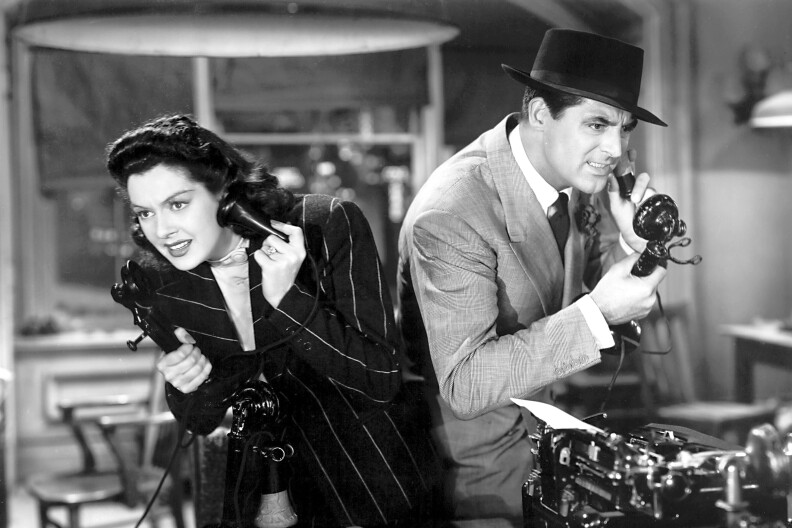 A black-and-white image of a 1940 era, curly-haired woman with her ear to the phone, next to a man in a suit with his ear to another phone.