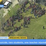 In this frame from video provided by KABC-TV, faculty and students evacuate North Park School Elementary School as emergency personnel respond to a shooting inside on Monday, April 10, 2017, in San Bernardino.