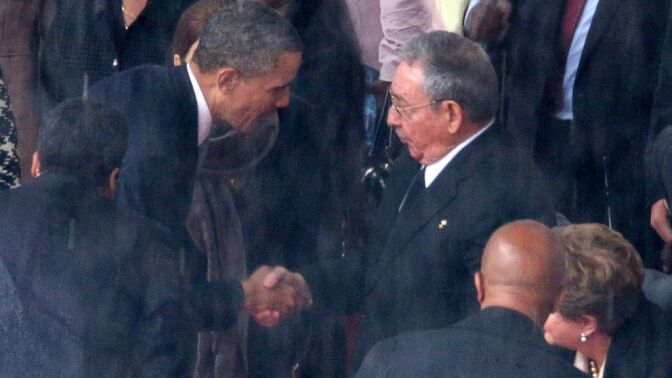  President Barack Obama shakes hands with Cuban President Raul Castro ...