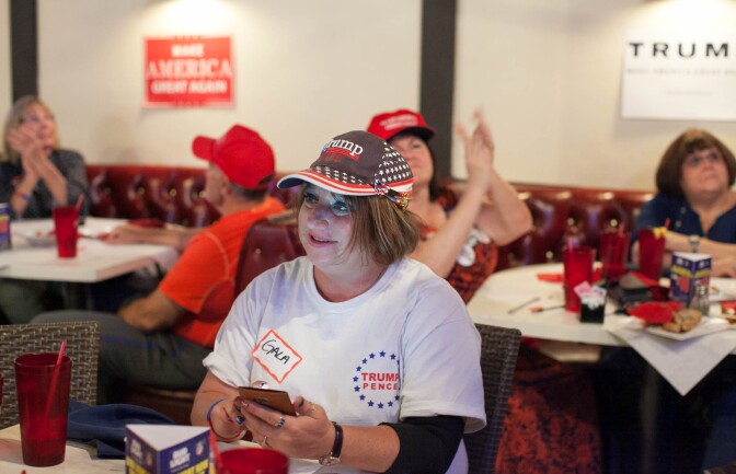 Gala Caprice Cruz, who helped organize the watch party, watches the second presidential debate at JJ's Bar & Grill in Santa Clarita, Calif. on Sunday, Oct. 9, 2016.