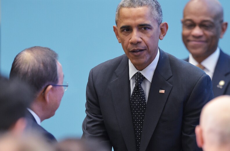 US President Barack Obama (C) greets United Nations Secretary General Ban Ki-moon after speaking at the White House Summit to Counter Violent Extremism at the State Department on February 19, 2015 in Washington, DC. AFP PHOTO/MANDEL NGAN        (Photo credit should read MANDEL NGAN/AFP/Getty Images)