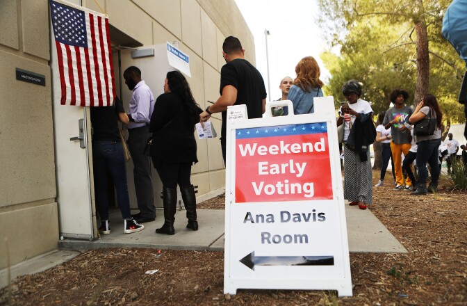 LANCASTER, CA - NOVEMBER 04:  Voters wait in line at a polling place to participate in early voting in California's 25th Congressional district on November 4, 2018 in Lancaster, California. Republican incumbent Rep. Steve Knight (CA-25) is competing against Democratic congressional candidate Katie Hill for his seat in the district. Democrats are targeting at least six congressional seats in California, currently held by Republicans, where Hillary Clinton won in the 2016 presidential election. These districts have become the centerpiece of their strategy to flip the House and represent nearly one-third of the 23 seats needed for the Democrats to take control of the chamber in the November 6 mid term elections.  (Photo by Mario Tama/Getty Images)