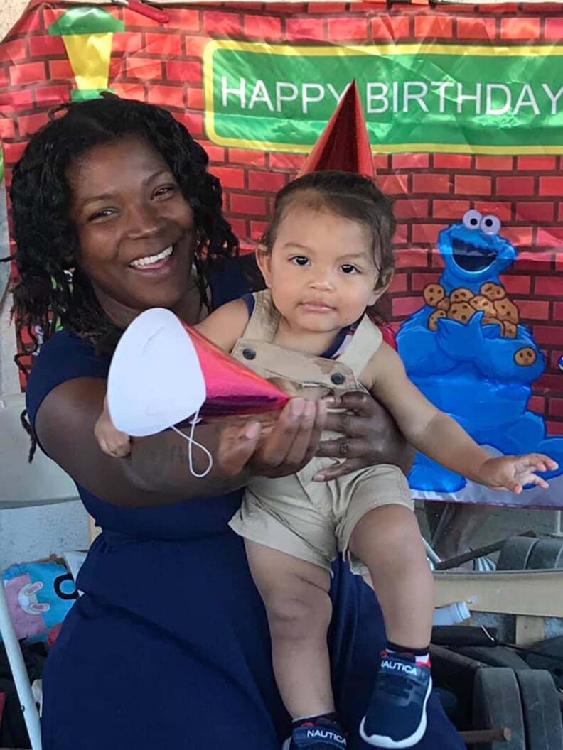 Nikidda and her son at a birthday party.