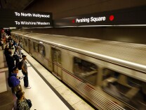 In this file photo, passengers board Metro subway trains during rush hour on June 3, 2008 in Los Angeles, California. 