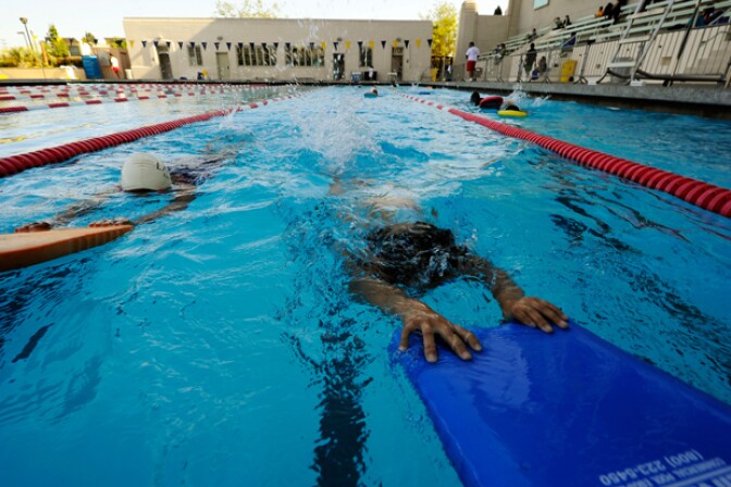  Adults and children swim in the LA Swim Stadium Pool on May 20, 2010 in Los Angeles, California.