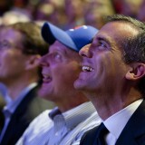 Los Angeles Mayor Eric Garcetti sits next to Clippers owner Steve Ballmer as they watch a highlight during a fan appreciation rally at the Staples Center.