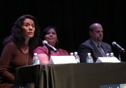 Los Angeles Unified School Board candidate Lisa Alva (left) speaks during a forum for candidates in District 2, which covers central and east L.A., as incumbent Mónica García (center) and candidate Carl Petersen sit nearby.