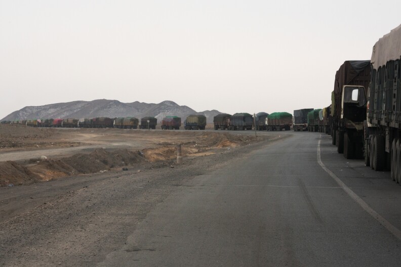 The road from Mongolia's Tavan Tolgoi coal mine to the border crossing at Gashuun Sukhait is 150 miles long. Backups can stretch for miles. Drivers may wait up to seven days in this line before reaching China.