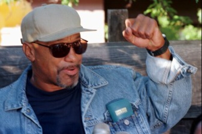 Former Black Panther Geronimo Pratt talks to the media upon his arrival to Marin City, Calif., on June 12, 1997. Pratt, who had just been released from prison, was visiting Marin City where his wife and children lived. 