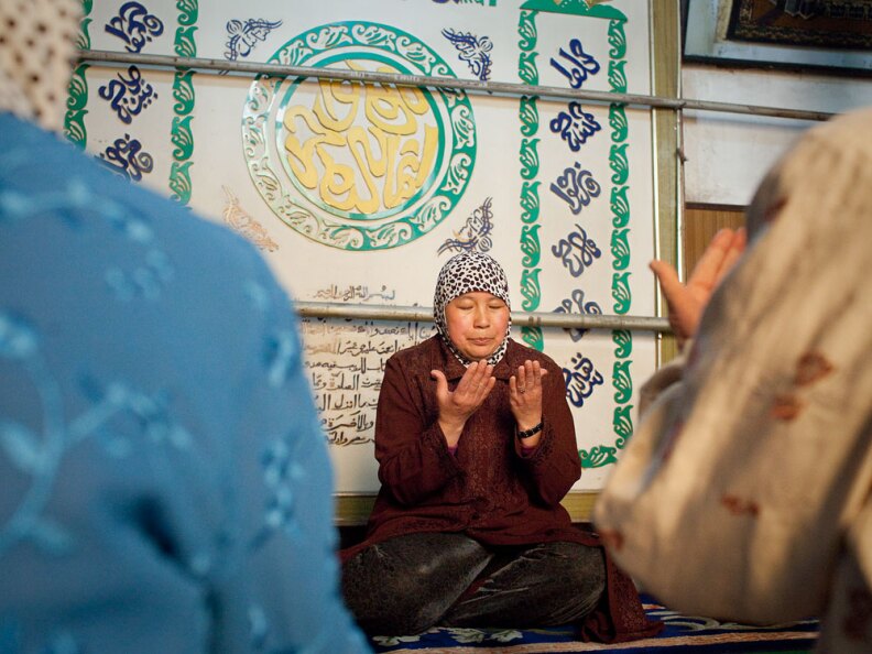 Yao Baoxia is a female <em>ahong</em>, or imam, at Wangjia Hutong Women's Mosque in Kaifeng, in central China. She sits alongside believers during prayers, not in front of them like male imams. She believes male and female imams are equal in their role as teachers and leaders of prayers.
