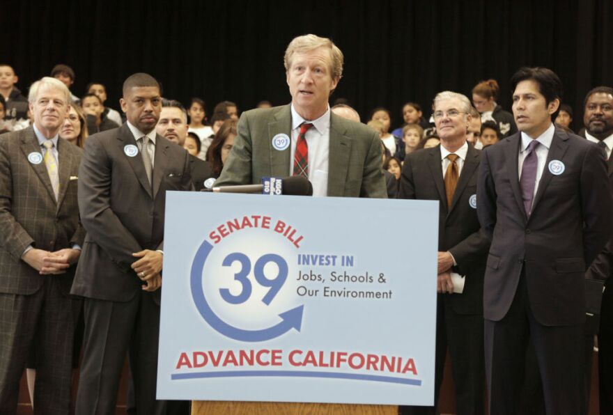Billionaire Tom Steyer, the chief financier behind the Proposition 39 campaign, discusses a proposed bill to fund energy efficiency projects at schools in California's poorest communities, during a news conference at Mark Twin Elementary School in Sacramento, Calif., Tuesday, Dec. 4, 2012.  The bill, co-authored by state Sen. Kevin de Leon, D-Los Angles, right, and Senate President Pro Tem Darrell Steinberg, D-Sacramento,  would use money from last month's voter approved initiative, Proposition 39, that requires $500 million for five years be used for clean air project.