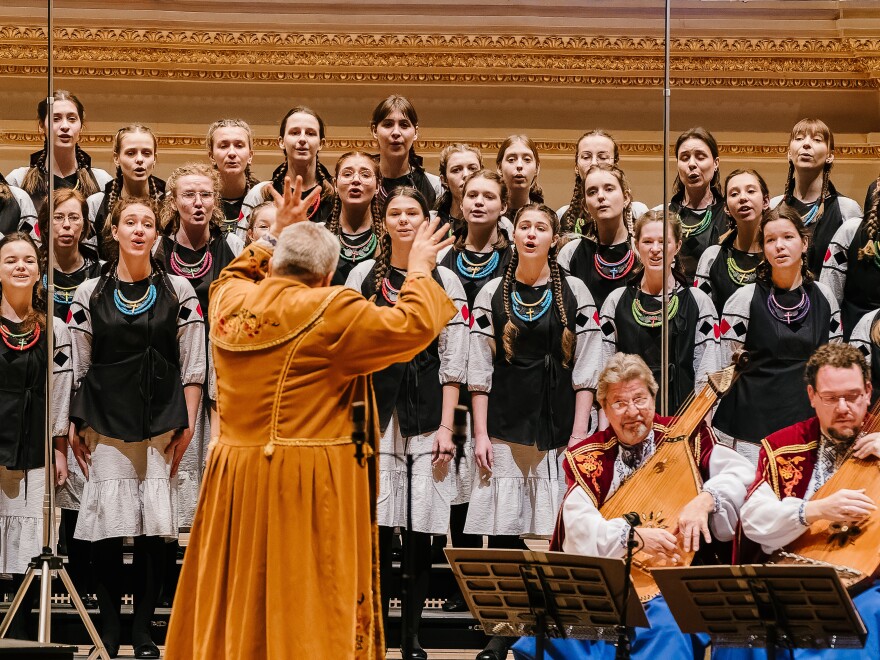 Oleh Mahlay, the artistic director of the Bandurist Choir, conducts members of the Ukrainian Bandurist Chorus of North America and Ukrainian Children's Choir at New York City's Carnegie Hall on Sunday.