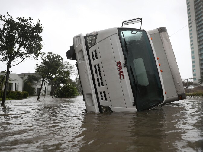 MIAMI, FL - SEPTEMBER 10:  A truck is seen on its side after being blown over as Hurricane Irma passed through on September 10, 2017 in Miami, Florida. Hurricane Irma, which first made landfall in the Florida Keys as a Category 4 storm on Sunday, has weakened to a Category 2 as it moves up the coast.  (Photo by Joe Raedle/Getty Images)