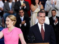 Mayor Eric Garcetti and First Lady Amy Wakeland greet the crowd for his inauguration at City Hall in Los Angeles, California on July 1, 2017.