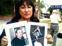 Esther Hatfield-Miller holds pictures of herself as a 15 year-old Reseda High School student and of Michael Nocita, the Catholic priest she alleges abused her in the 1970s.