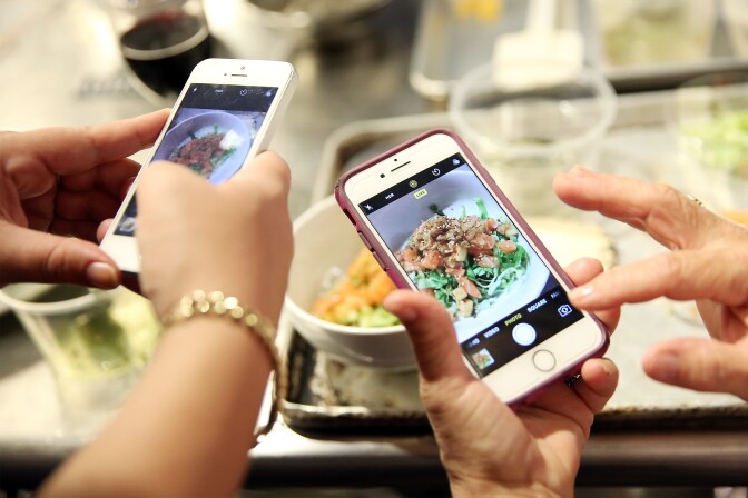 NEW YORK, NY - OCTOBER 15:  Guests participate in the Korean Cuisine Master Class hosted by Atoboy at the Institute of Culinary Education on October 15, 2017 in New York City.  (Photo by Monica Schipper/Getty Images for NYCWFF)