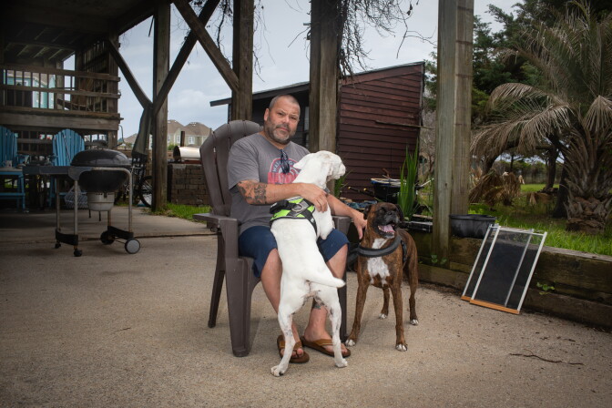 A man with his dogs.