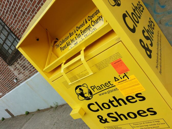 The Sanitation Department is evicting this collection bin (belonging to the Planet Aid organization) from the public sidewalk on which it has taken up residence. If it doesn't make itself scarce within 30 days, it will be condemned and hauled away under DSNY's Derelict Vehicle Removal Program.