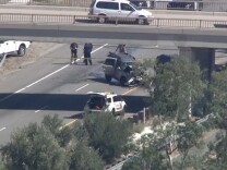 A San Bernardino County Sheriff's deputy shot from a helicopter at a car going the wrong way on the 215 Freeway, Friday, Sept. 18, 2015 NBC LA