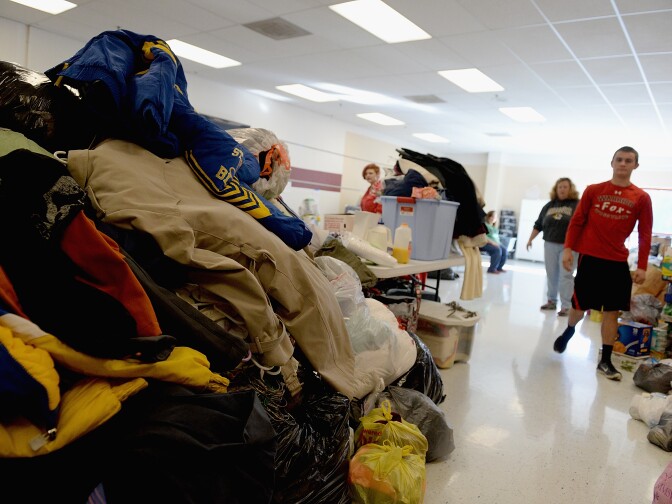 Stacks of donated clothing and goods are seen at a flood relief donation drive at Fox High School on January 2, 2016 in Arnold, Missouri.